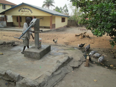 Mercy Children's Home - Using the water pump
